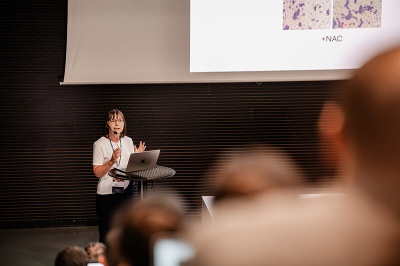 A speaker presenting at the symposium